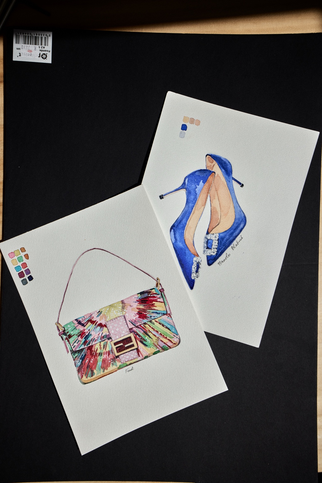 Watercolour illustrations of a handbag and blue high-heeled shoes